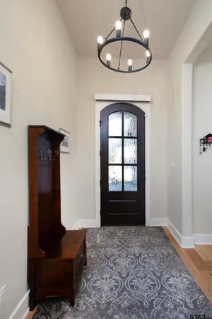 a view of empty room with a windows and ceiling fan