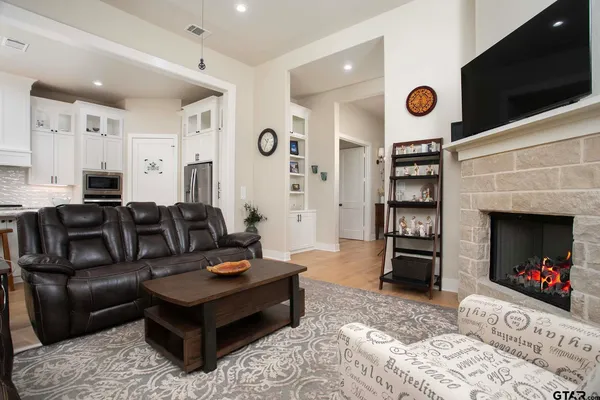 a living room with furniture and a fireplace