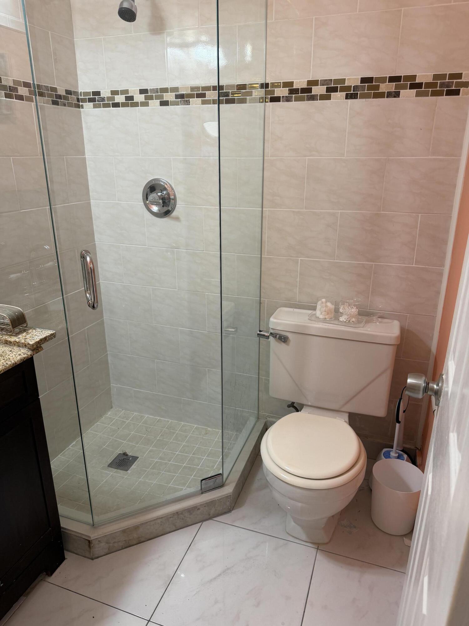8588 Bella Vista Drive Boca Raton, FL 33433 - Photo 11 of 12 a bathroom with a toilet and a shower