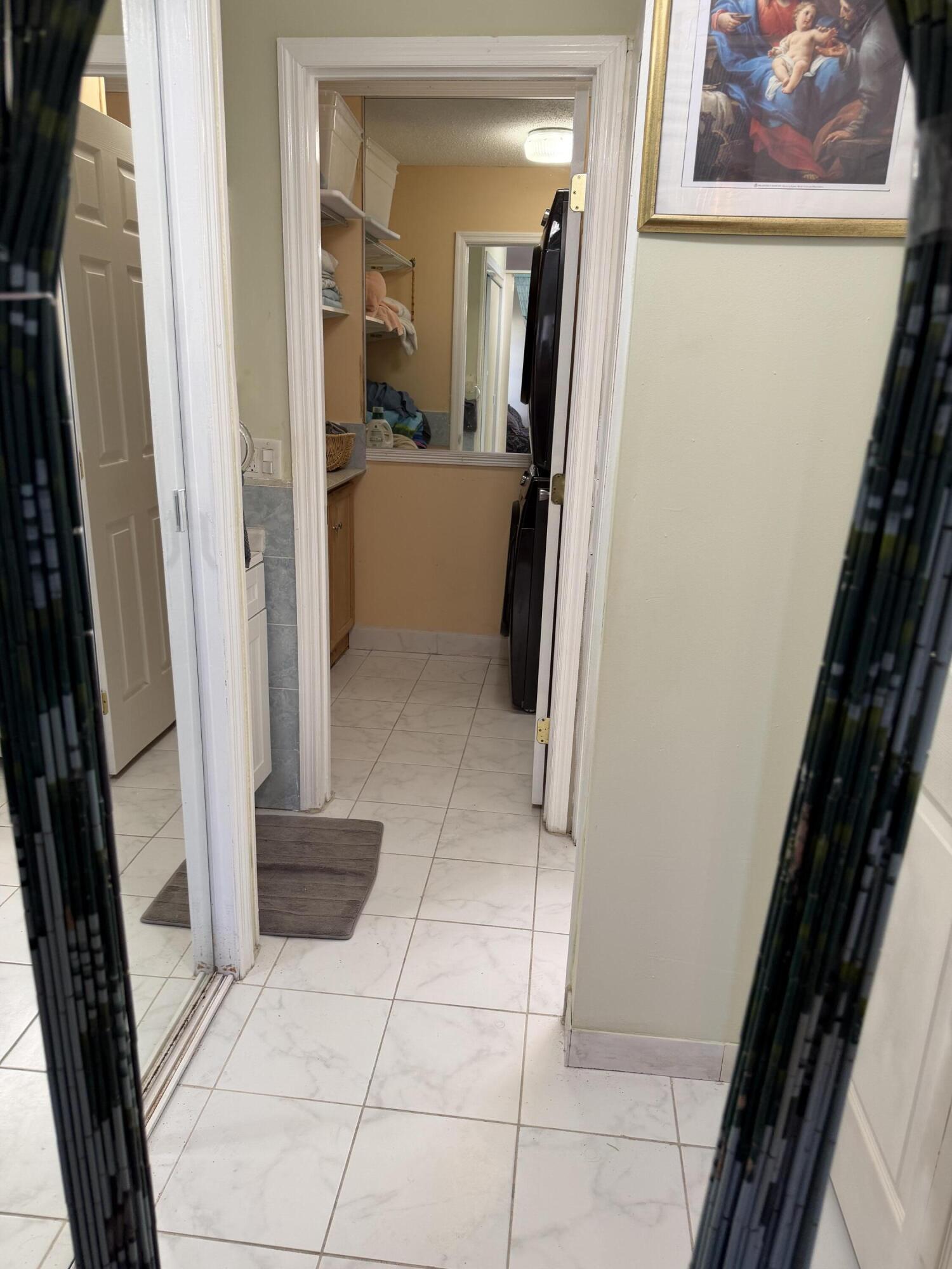 8588 Bella Vista Drive Boca Raton, FL 33433 - Photo 6 of 12 a view of bathroom with a sink and mirror