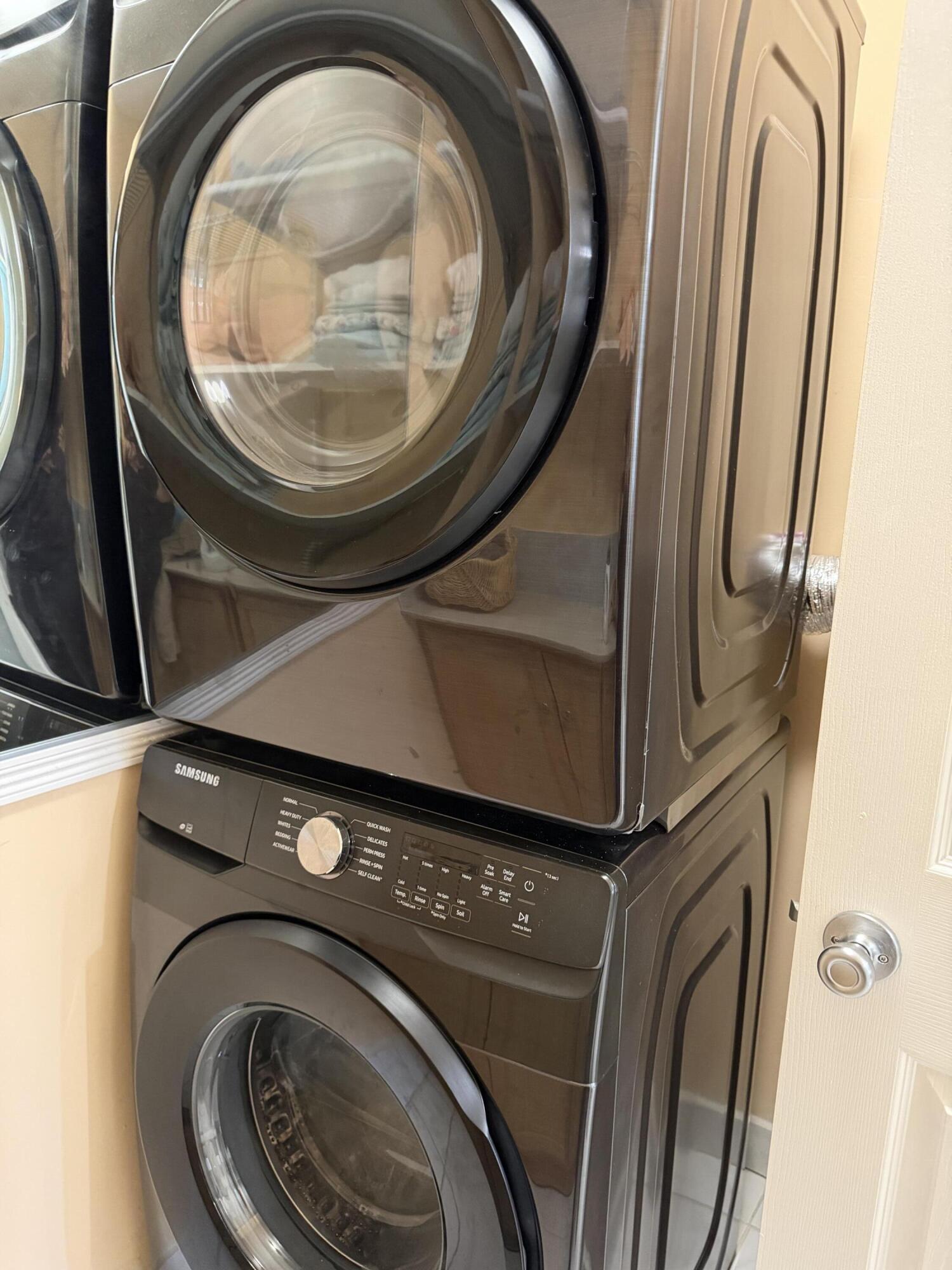 8588 Bella Vista Drive Boca Raton, FL 33433 - Photo 8 of 12 a close up view of washer and dryer