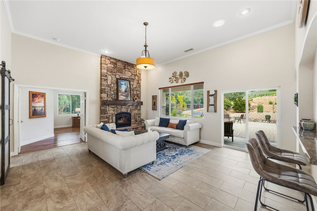 45600 La Cruz Drive Temecula, CA 92590 - Photo 20 of 75 a living room with furniture chandelier and a fireplace