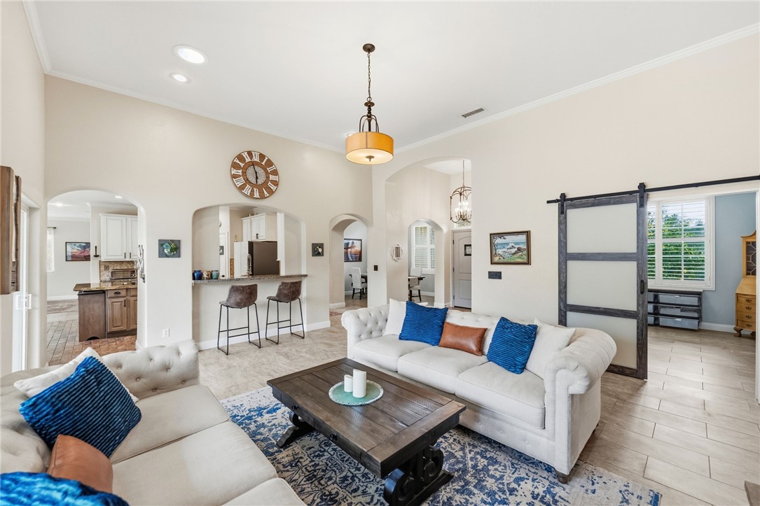 45600 La Cruz Drive Temecula, CA 92590 - Photo 22 of 75 a living room with furniture a rug and a chandelier