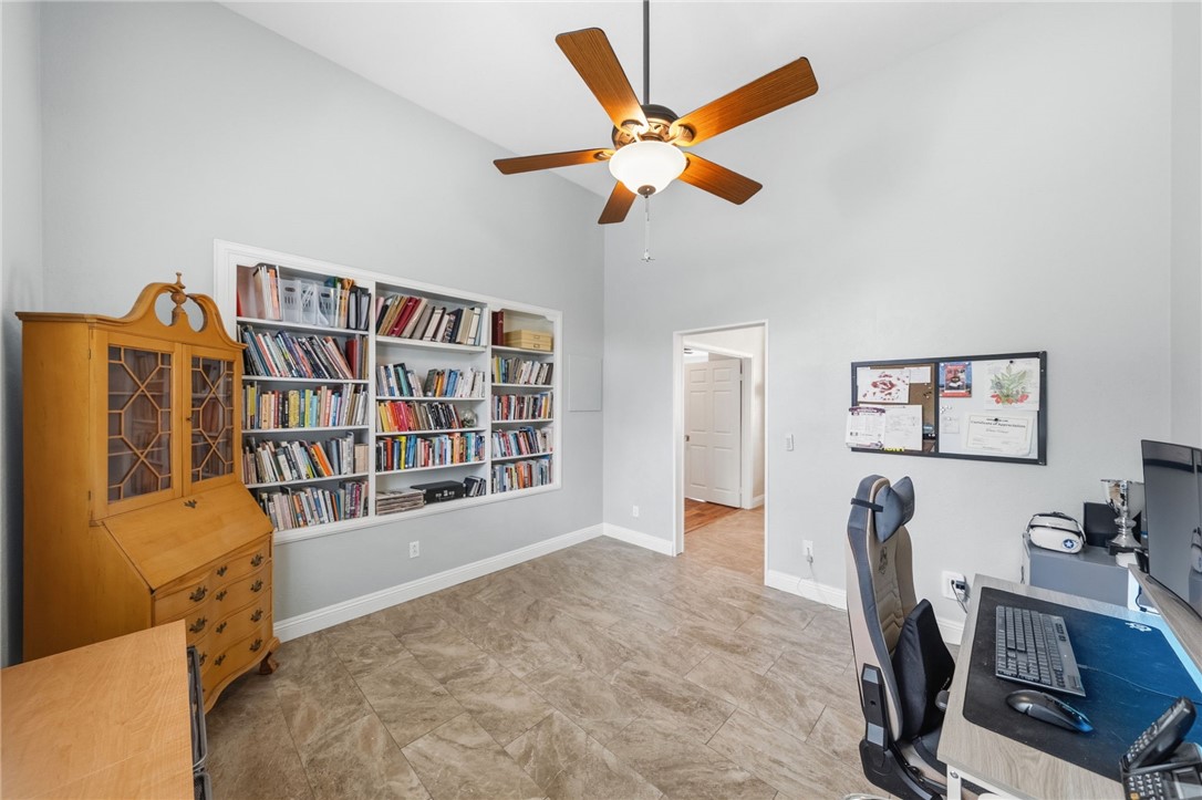 45600 La Cruz Drive Temecula, CA 92590 - Photo 41 of 75 a view of a workspace with furniture and a bookshelf