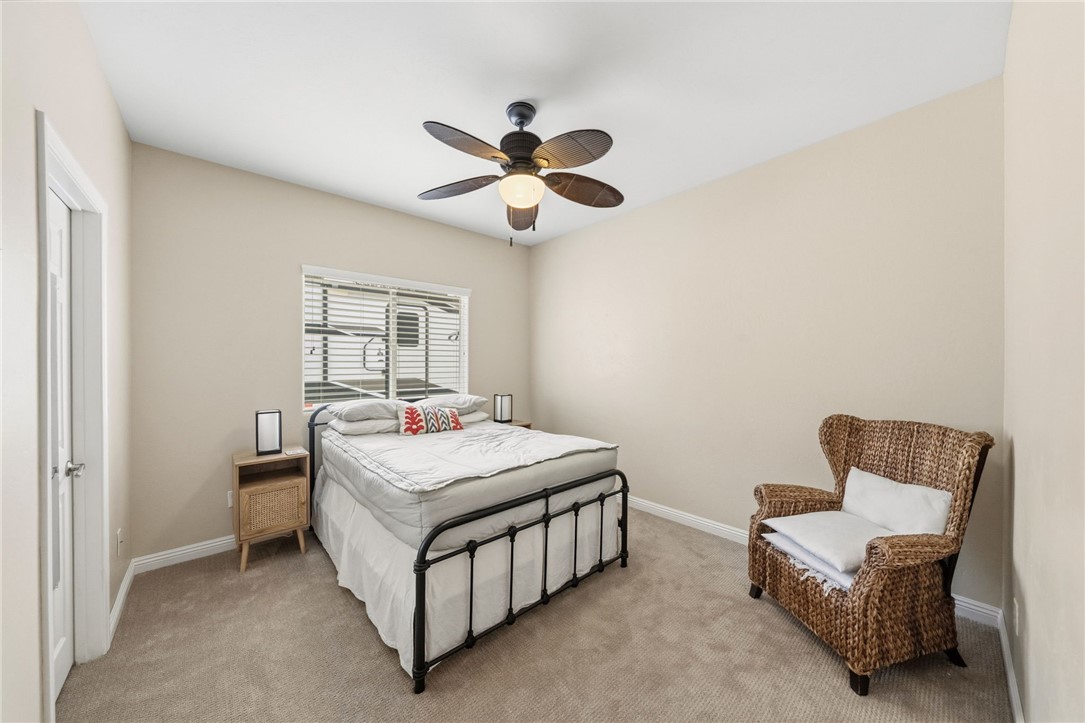 45600 La Cruz Drive Temecula, CA 92590 - Photo 51 of 75 a bedroom with a bed and a chandelier