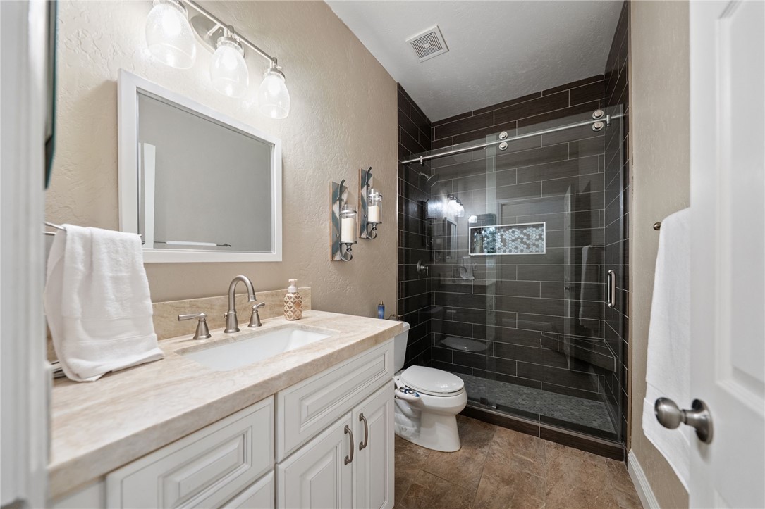 45600 La Cruz Drive Temecula, CA 92590 - Photo 53 of 75 a bathroom with a sink a toilet and shower