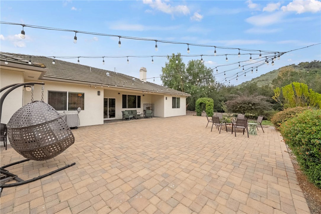 45600 La Cruz Drive Temecula, CA 92590 - Photo 65 of 75 a view of a patio with table and chairs and potted plants