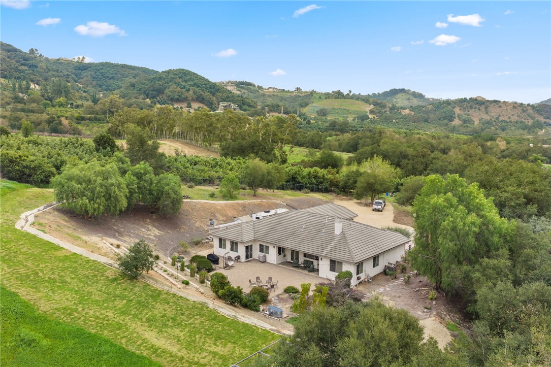 45600 La Cruz Drive Temecula, CA 92590 - Photo 10 of 75 an aerial view of a house with a garden and mountains