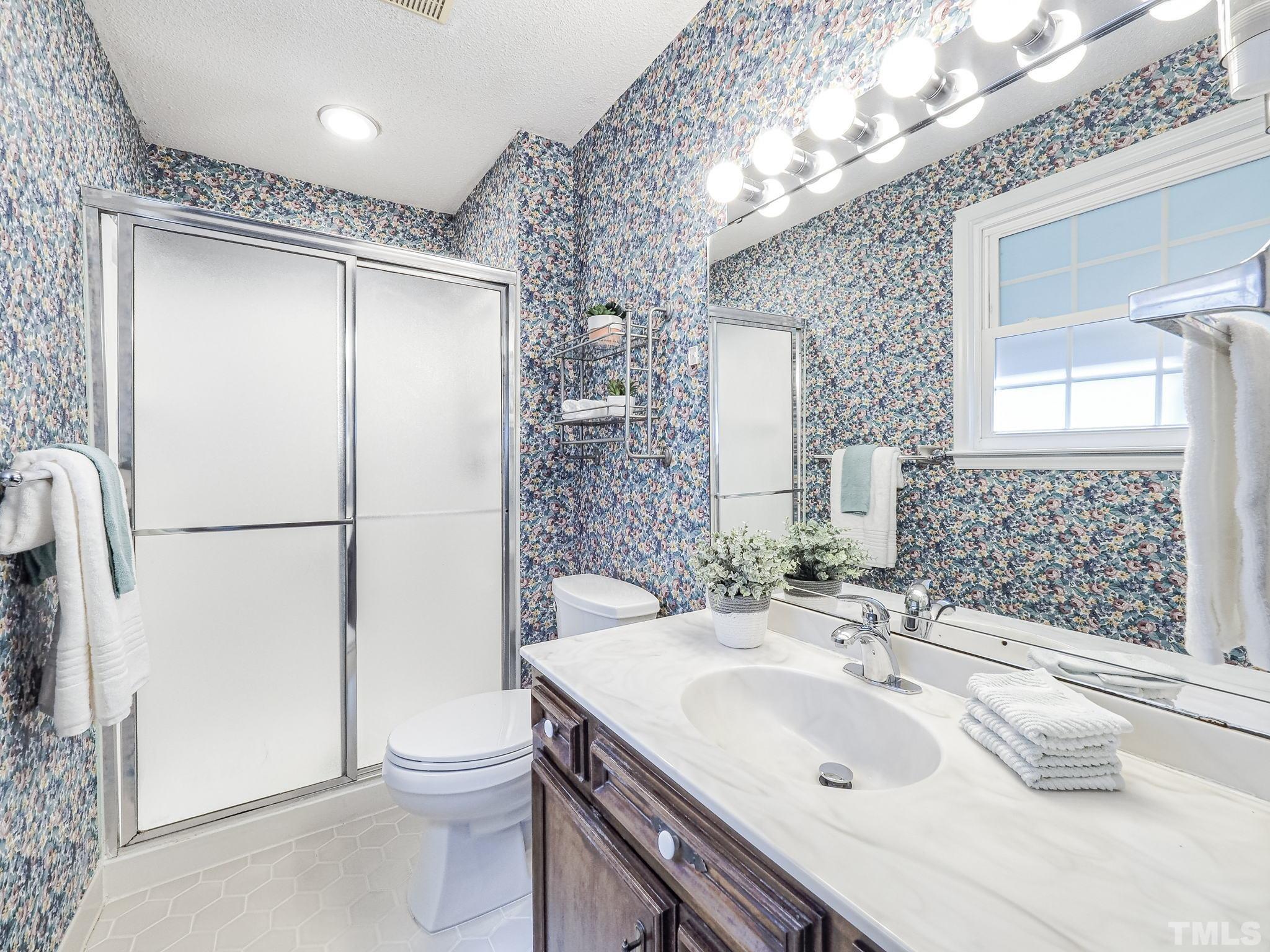 2624 Catalina Drive Raleigh, NC 27607 - Photo 28 of 35 a bathroom with a sink toilet and shower