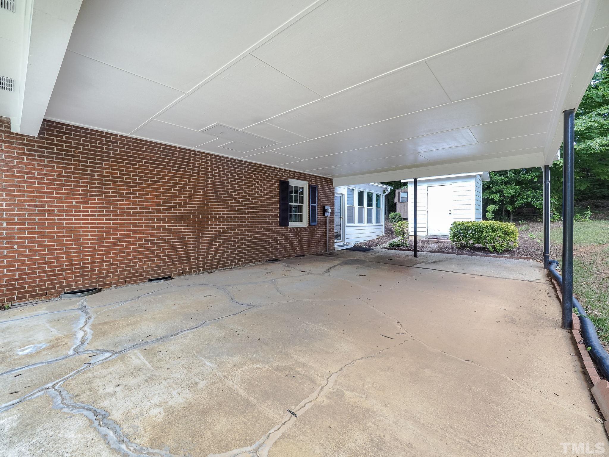2624 Catalina Drive Raleigh, NC 27607 - Photo 29 of 35 a view of an empty room with potted plants