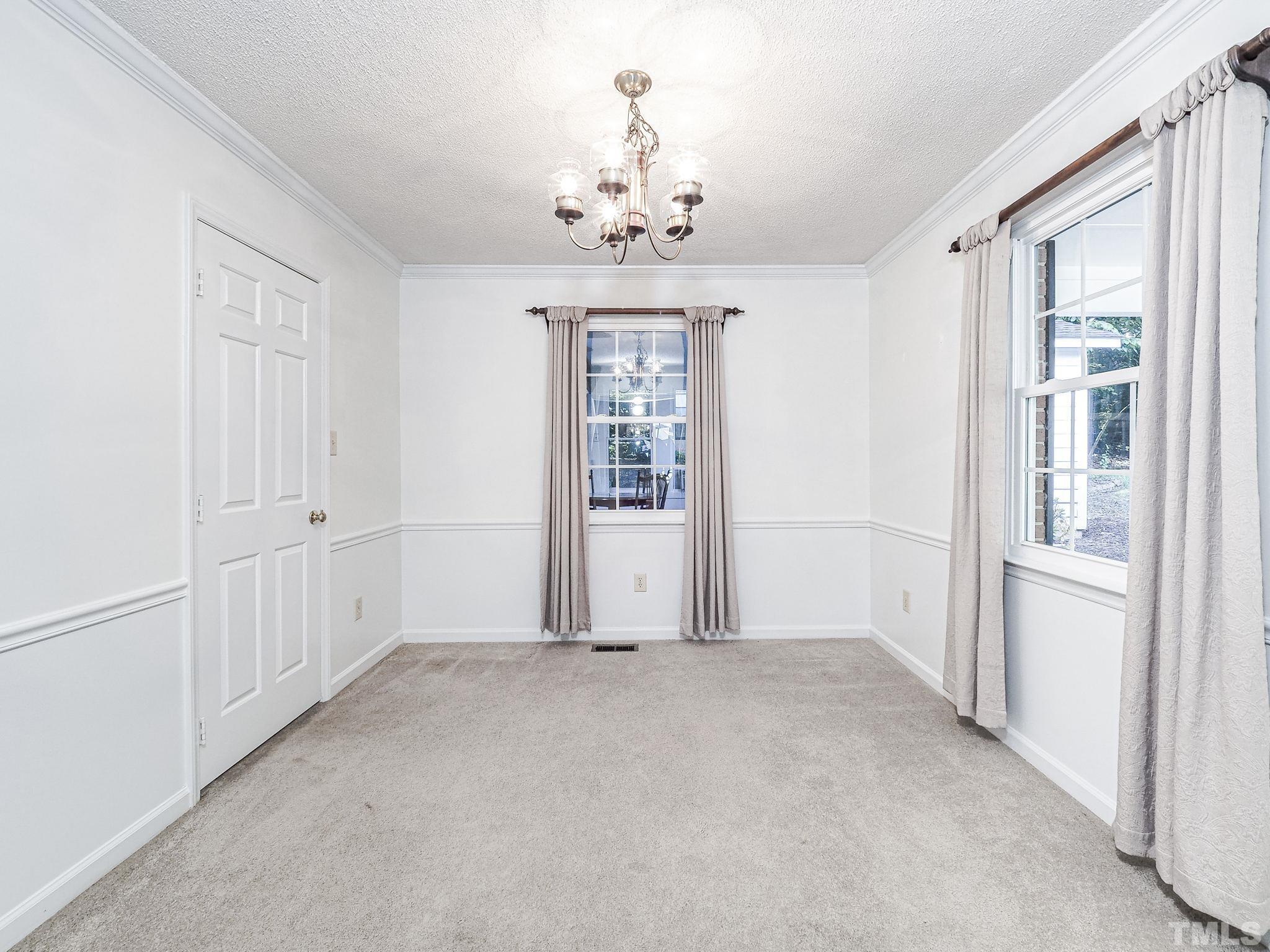 2624 Catalina Drive Raleigh, NC 27607 - Photo 9 of 35 a view of an empty room with a window