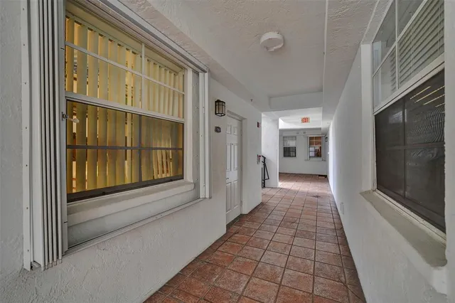 a view of a hallway with a outdoor space