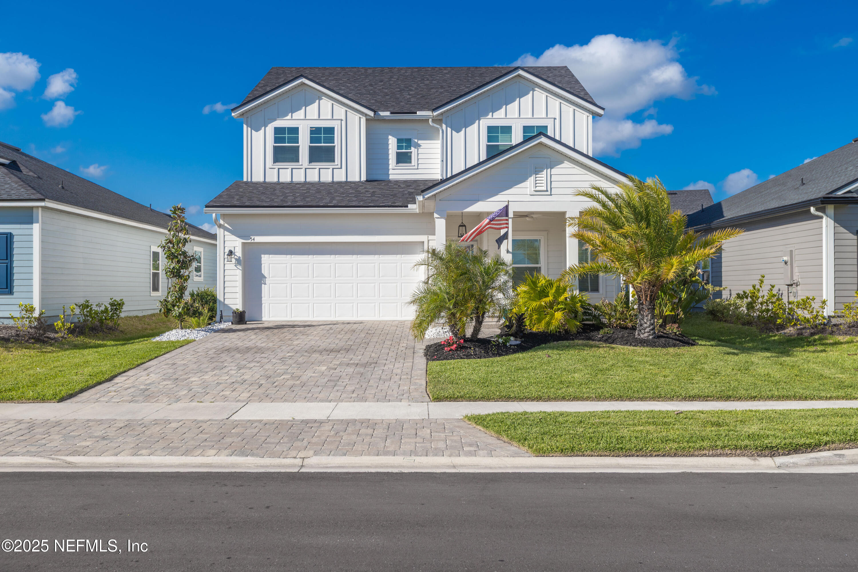 54 Wiltshire Drive St. Augustine, FL 32092 - Photo 1 of 23 a front view of a house with a yard and garage