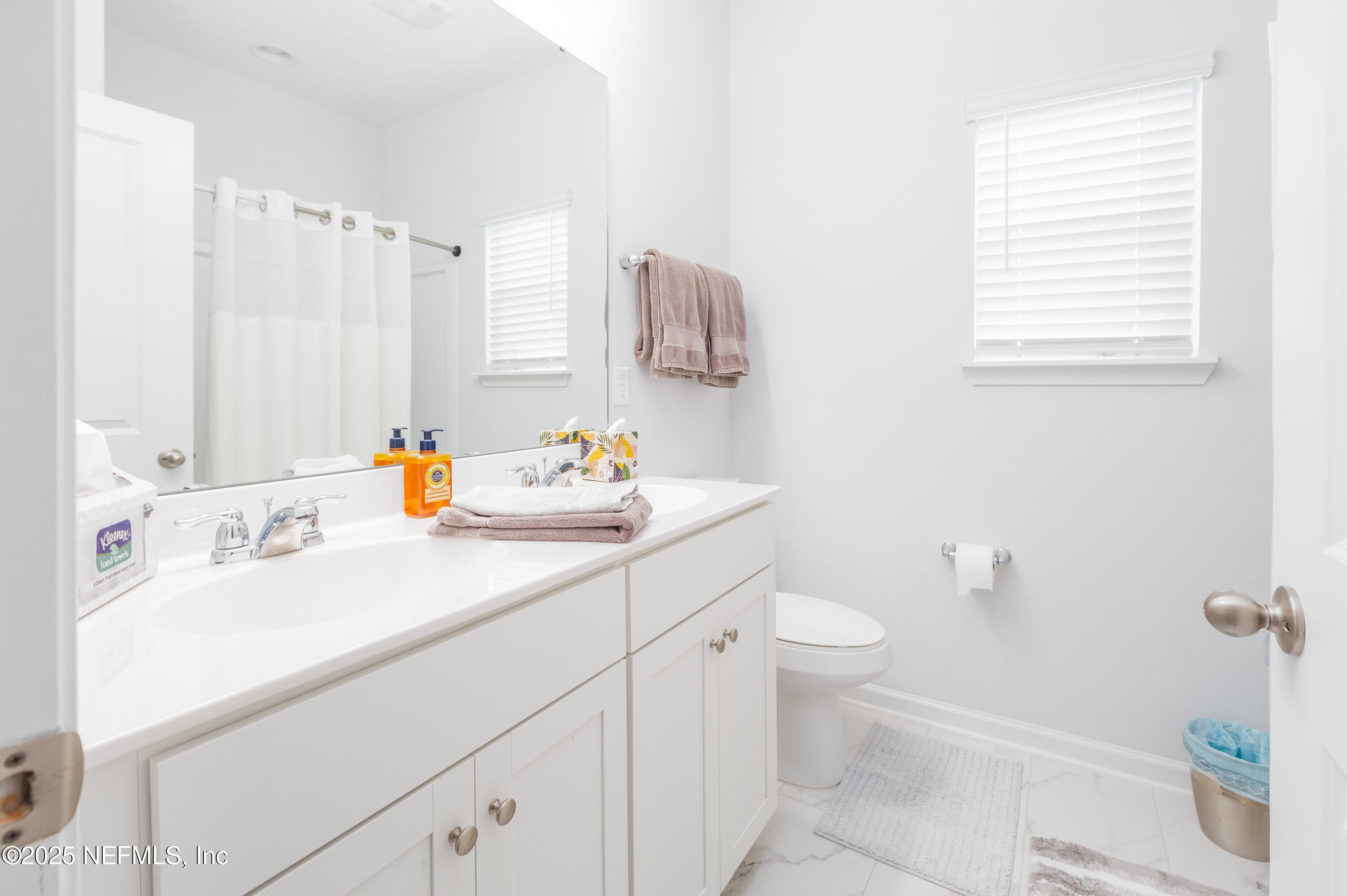54 Wiltshire Drive St. Augustine, FL 32092 - Photo 11 of 23 a bathroom with a sink toilet vanity and tub