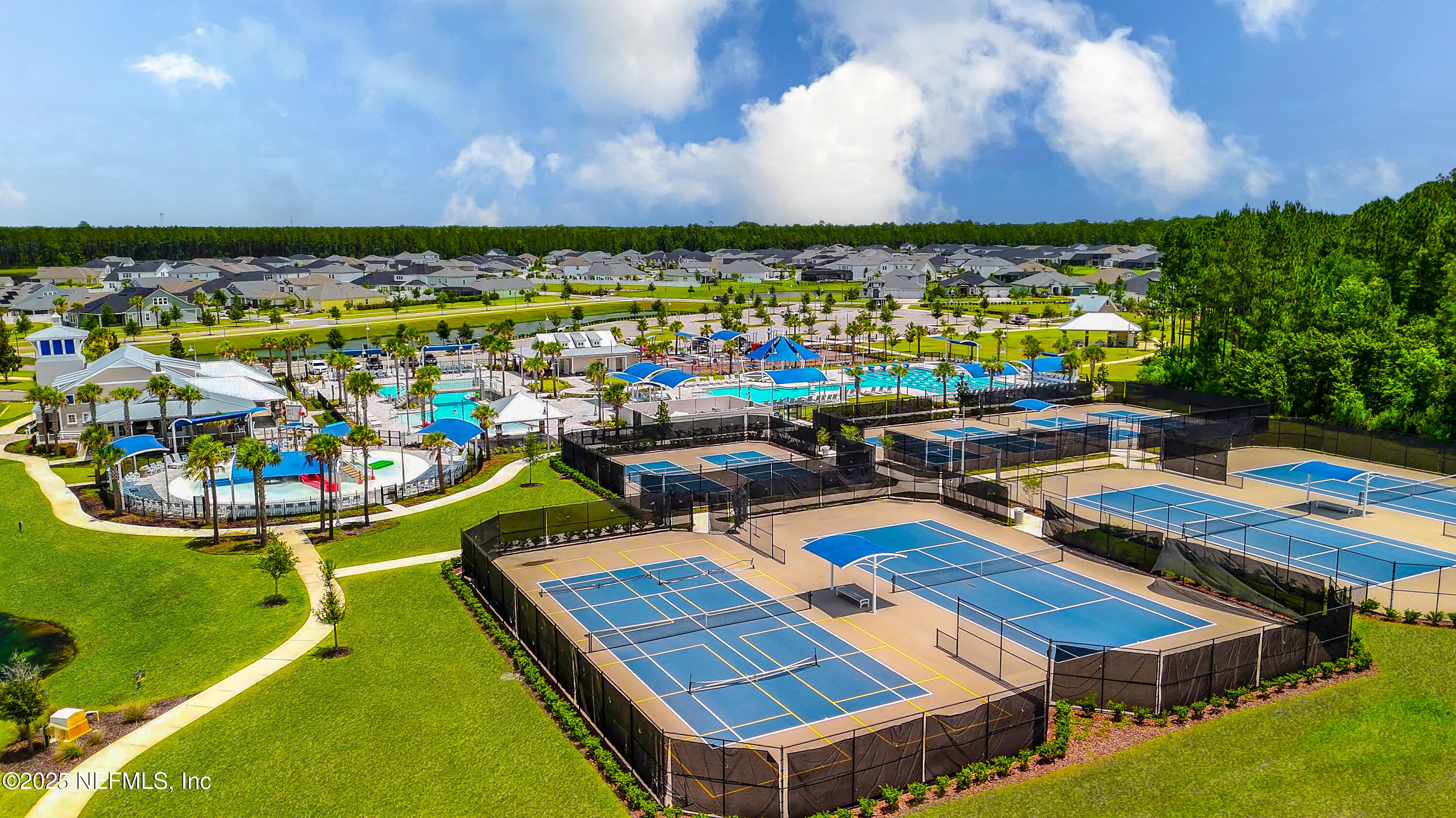 54 Wiltshire Drive St. Augustine, FL 32092 - Photo 23 of 23 a view of a swimming pool with lawn chairs