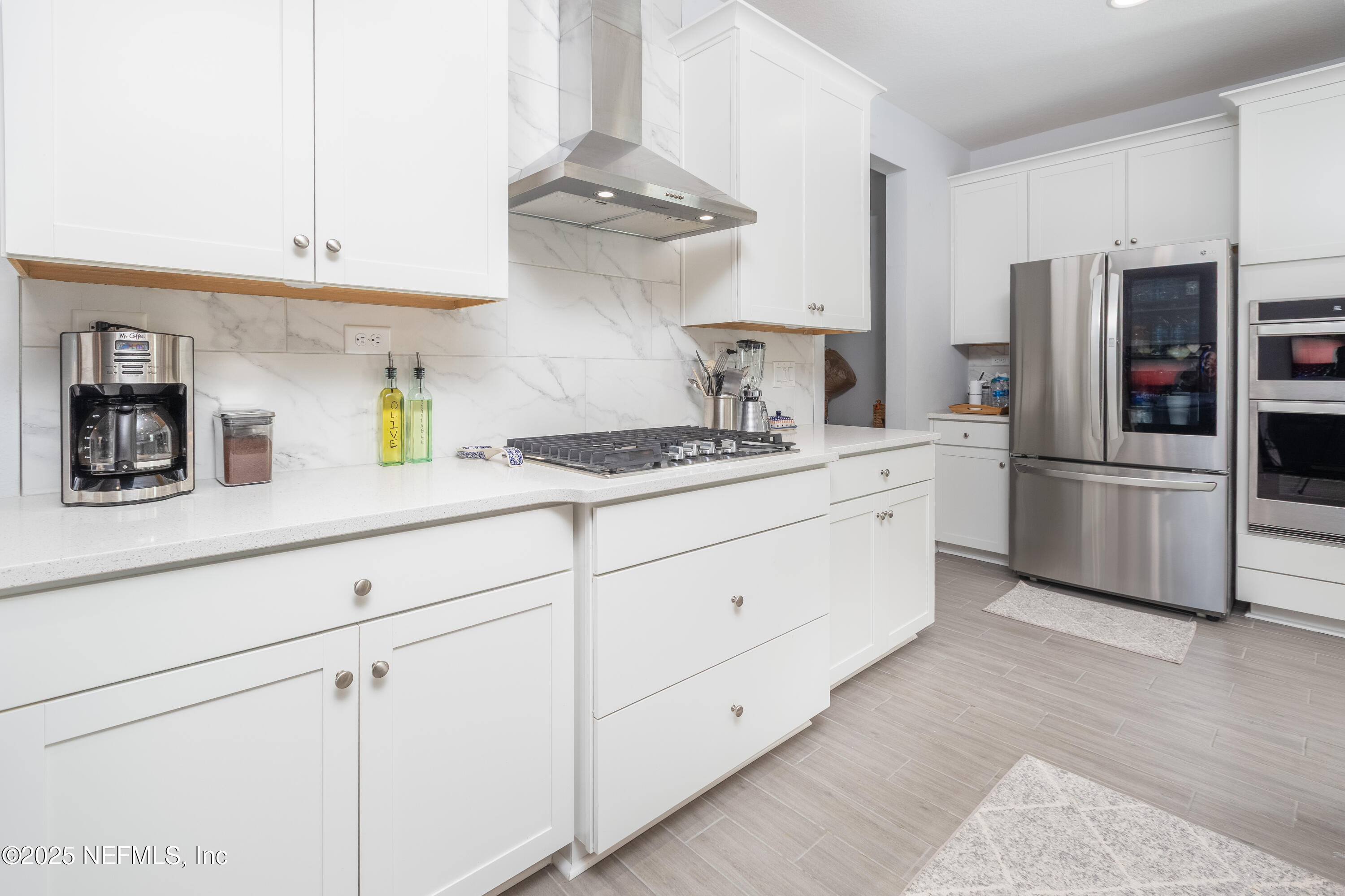 54 Wiltshire Drive St. Augustine, FL 32092 - Photo 3 of 23 a kitchen with cabinets and stainless steel appliances