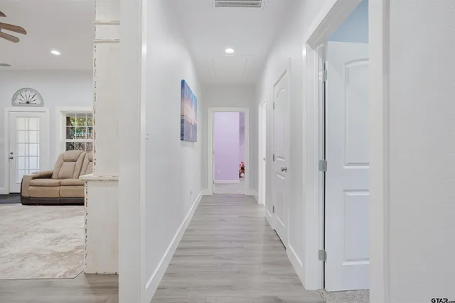 a bedroom with furniture and a ceiling fan