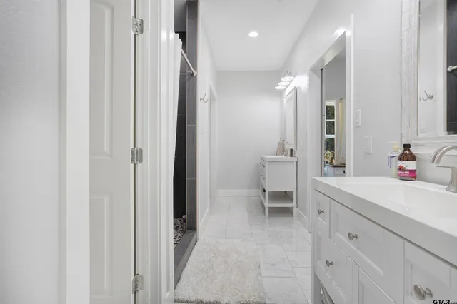 a view of walk in closet with clothes