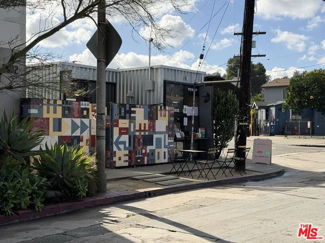 a view of a living room with wooden floor
