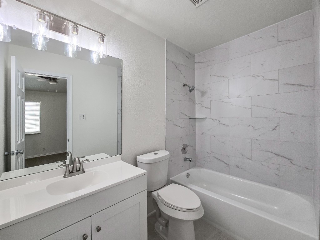 300 Tamara Drive, Unit B Georgetown, TX 78628 - Photo 12 of 16 a bathroom with a sink a toilet and shower