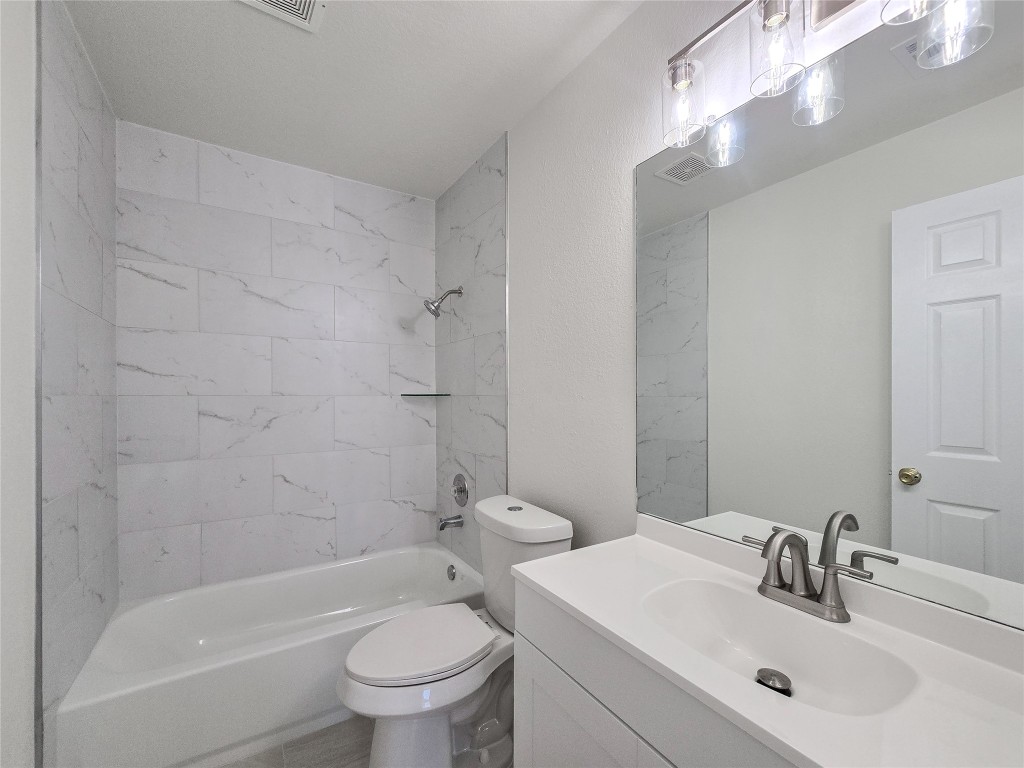 300 Tamara Drive, Unit B Georgetown, TX 78628 - Photo 15 of 16 a bathroom with a sink toilet and shower