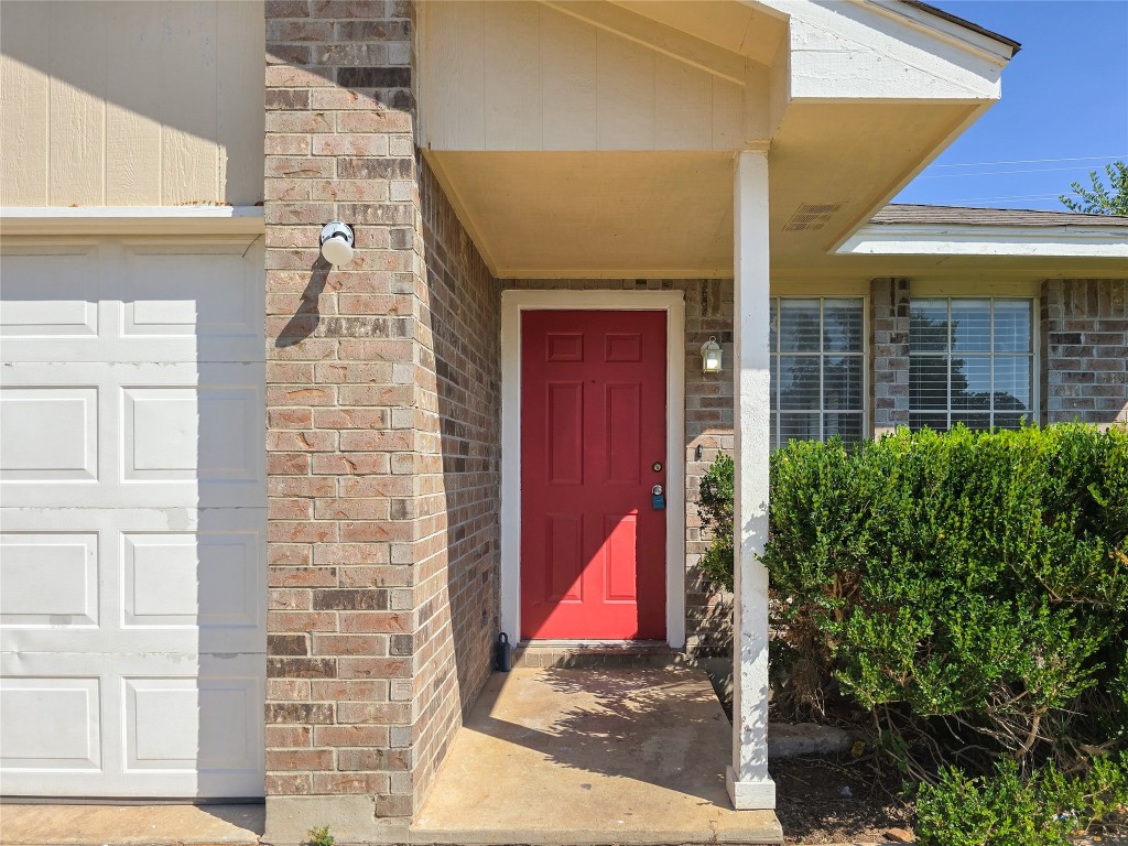 300 Tamara Drive, Unit B Georgetown, TX 78628 - Photo 3 of 16 a building with red door and door