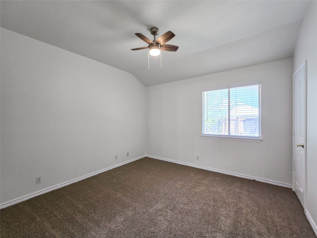 300 Tamara Drive, Unit B Georgetown, TX 78628 - Photo 10 of 16 an empty room with a window and a fan