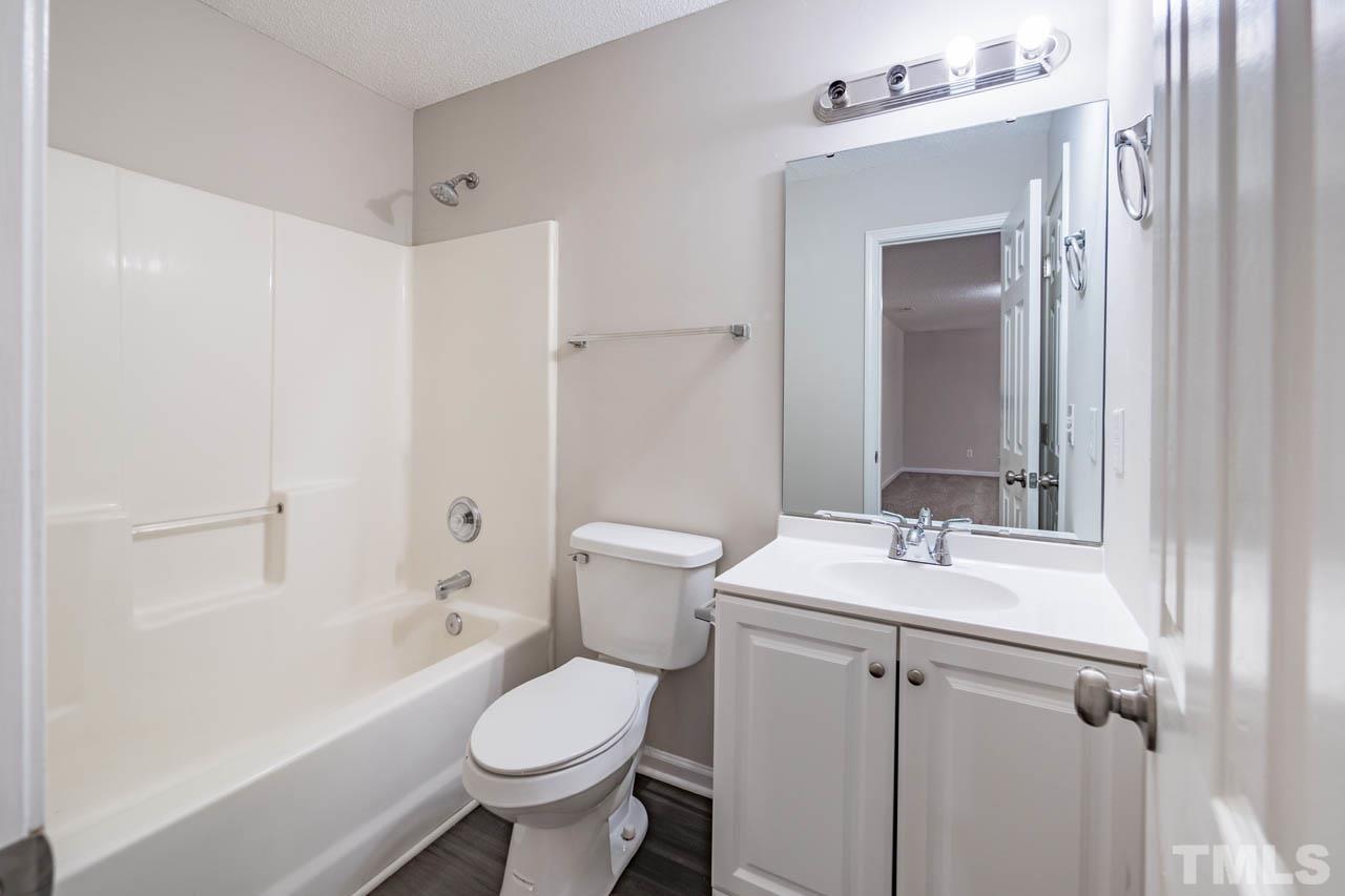 5016 Marathon Lane Raleigh, NC 27616 - Photo 22 of 27 a bathroom with a sink toilet and shower