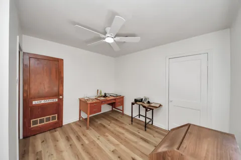 a room with furniture and wooden floor