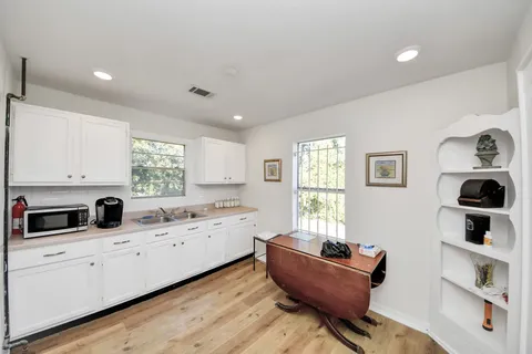 a kitchen with a refrigerator and window