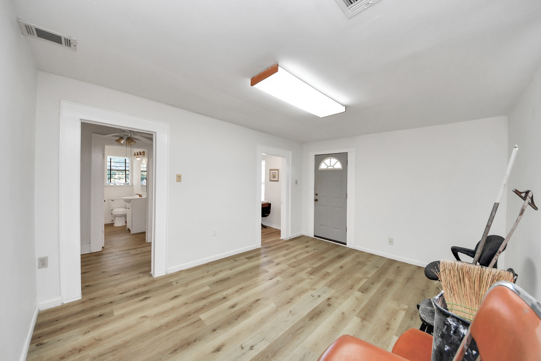 5303 Lyons Avenue, Unit 4 Houston, TX 77020 - Photo 28 of 40 a view of an empty room with wooden floor and a window