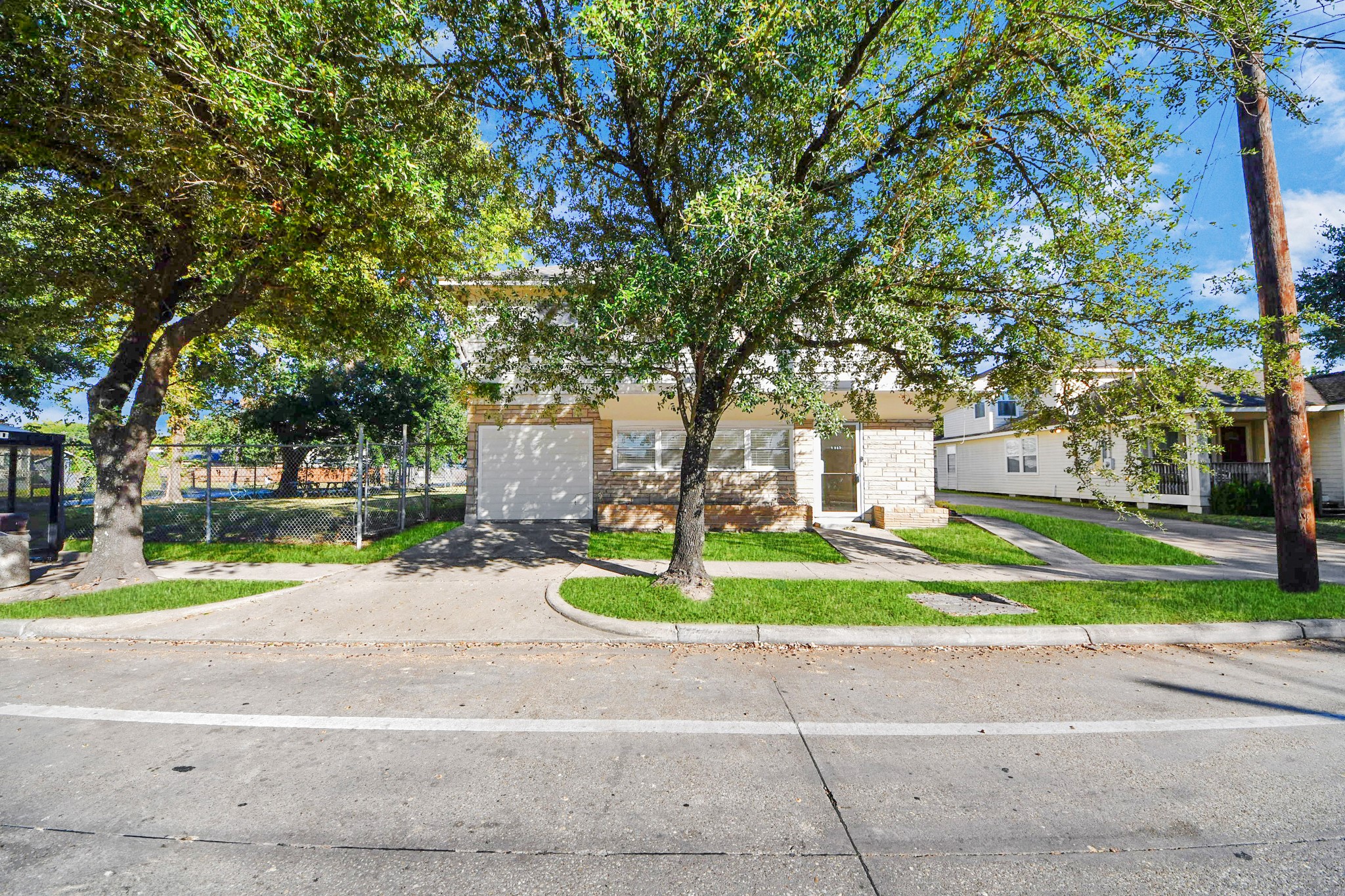 5303 Lyons Avenue, Unit 4 Houston, TX 77020 - Photo 3 of 40 a house with trees in the background