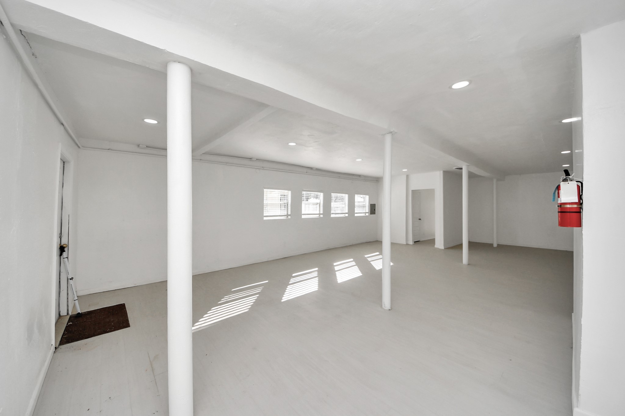 5303 Lyons Avenue, Unit 4 Houston, TX 77020 - Photo 32 of 40 a view of a hallway with wooden floor and a cabinet