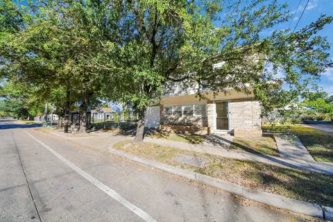 a view of a backyard with sitting area