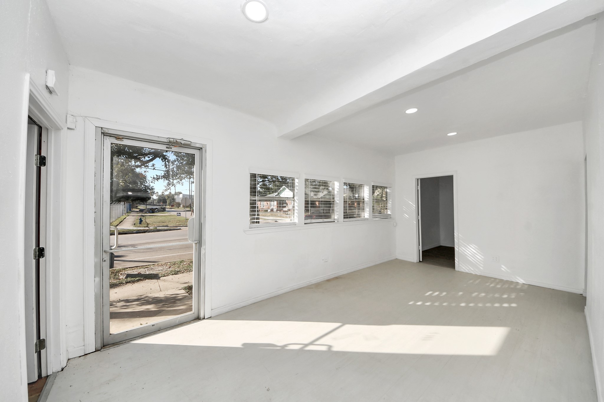 5303 Lyons Avenue, Unit 4 Houston, TX 77020 - Photo 9 of 40 a view of an empty room with window and bathroom