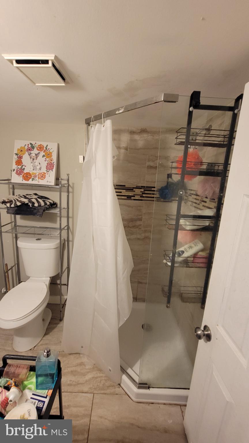 5105 Plymouth Road Baltimore, MD 21214 - Photo 20 of 29 Modern bathroom with sleek glass shower.