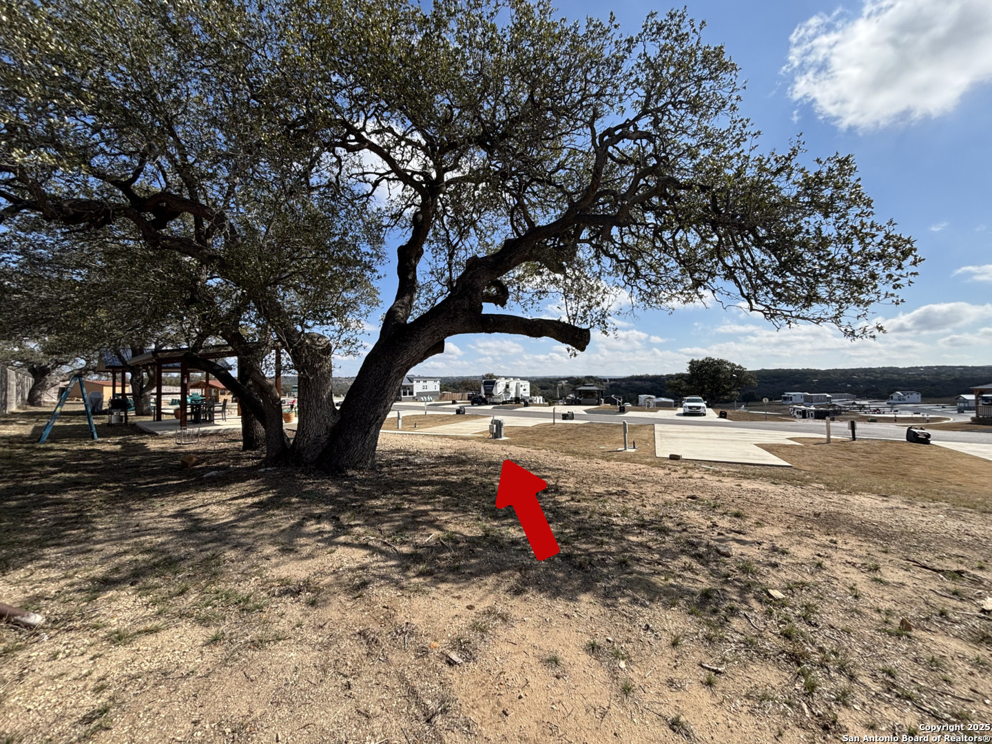 5386 Ranch Road 1376, Unit 63 Fredericksburg, TX 78624 - Photo 2 of 31 a view of a yard with plants and trees
