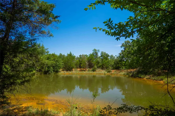 a view of a lake with houses in the background