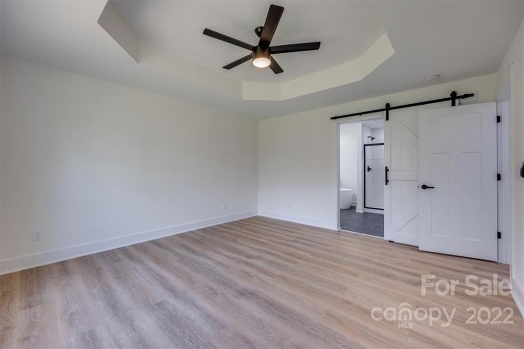 1009 Rainbow Circle Catawba, SC 29704 - Photo 14 of 21 a view of a livingroom with a hardwood floor and a ceiling fan