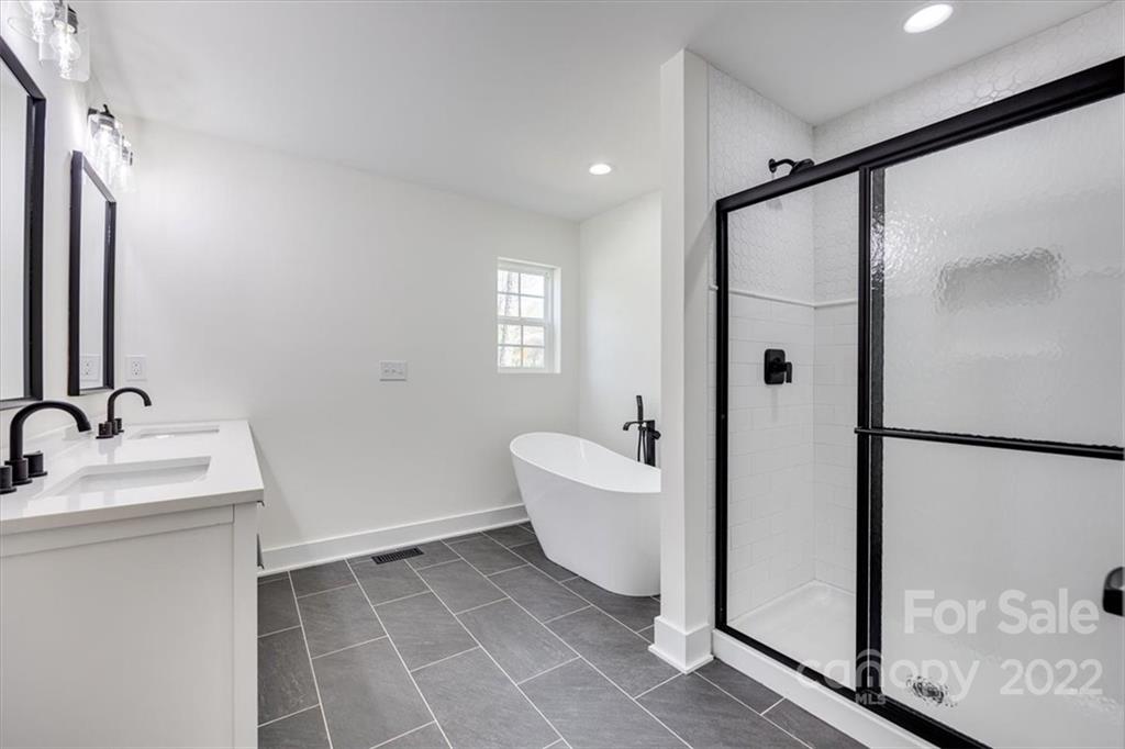 1009 Rainbow Circle Catawba, SC 29704 - Photo 15 of 21 a bathroom with a sink and mirror with bathtub
