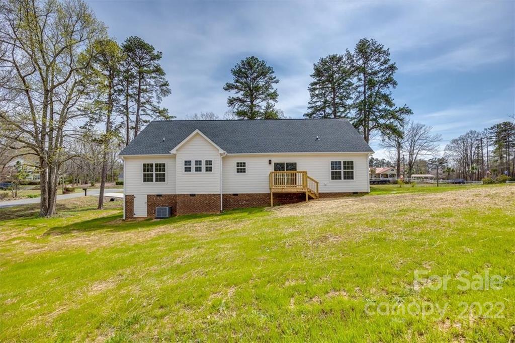 1009 Rainbow Circle Catawba, SC 29704 - Photo 19 of 21 a view of a house with a yard covered with trees