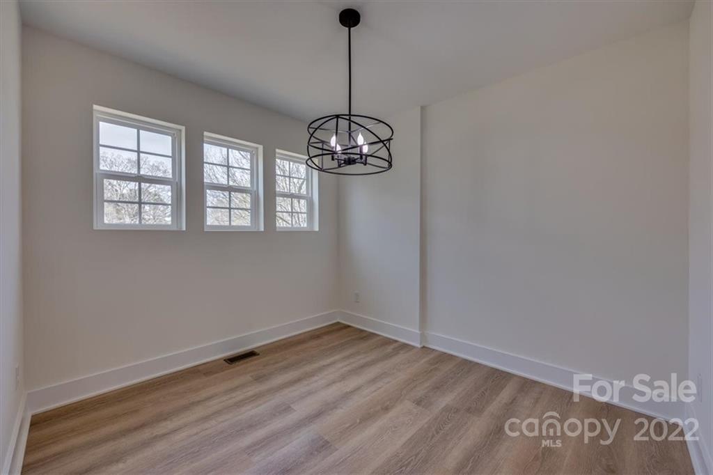 1009 Rainbow Circle Catawba, SC 29704 - Photo 10 of 21 a view of a room with wooden floor chandelier and windows