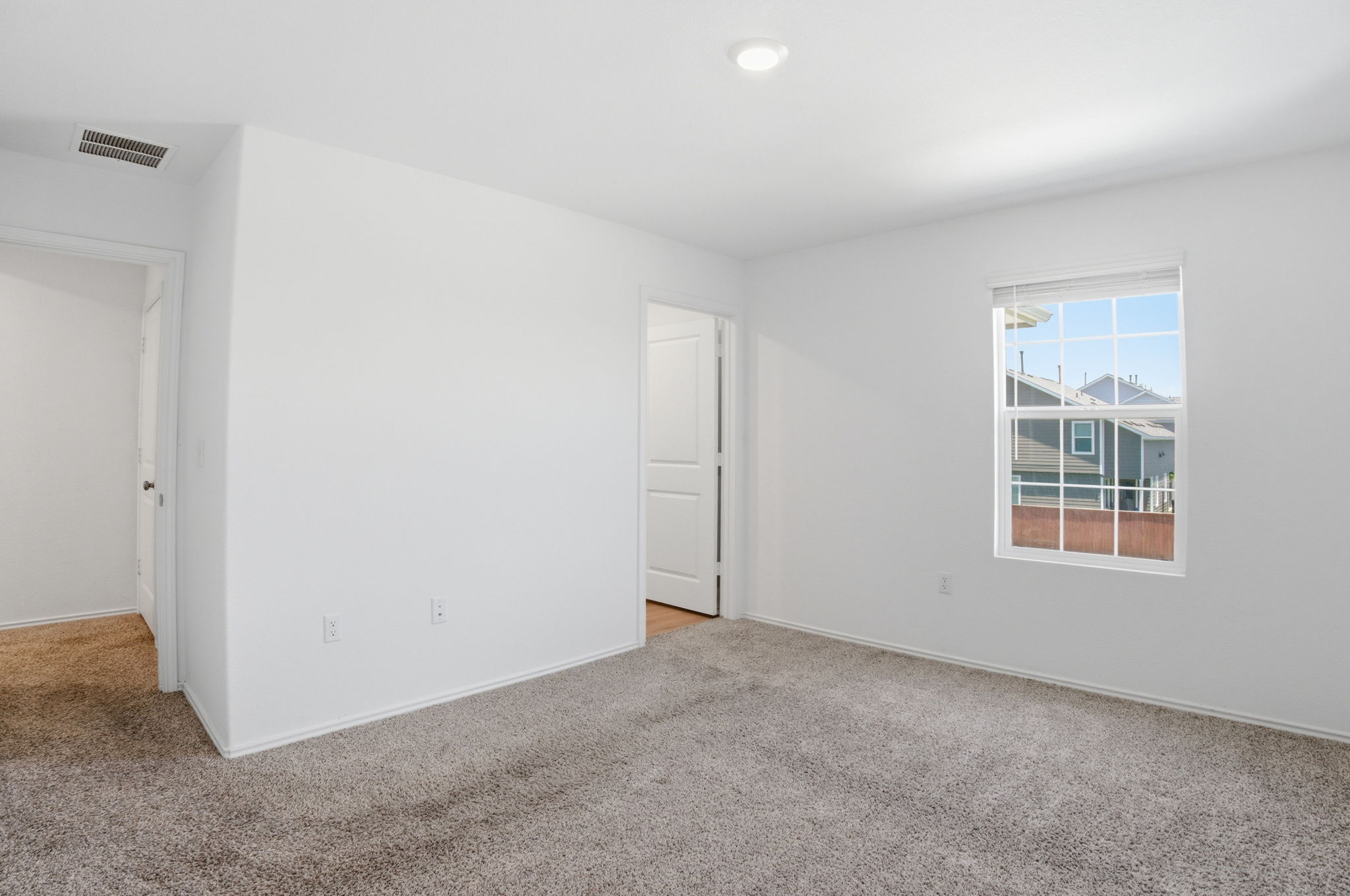 12213 Rising Moon Lane Del Valle, TX 78617 - Photo 7 of 19 an empty room with windows