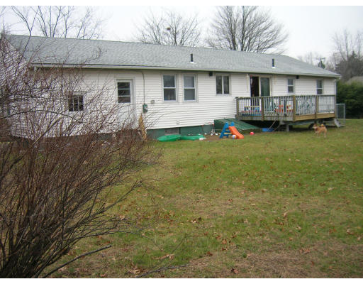 676 Granby Road Chicopee, MA 01013 - Photo 11 of 13 a view of a house with a backyard and balcony