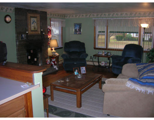 676 Granby Road Chicopee, MA 01013 - Photo 3 of 13 a living room with furniture and a fireplace