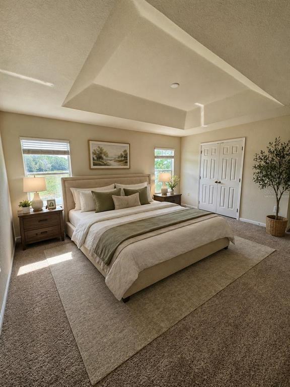 2543 Old Kent Circle Kissimmee, FL 34758 - Photo 12 of 41 a bedroom with a bed and a couch