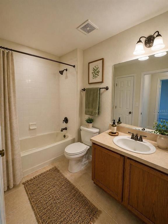 2543 Old Kent Circle Kissimmee, FL 34758 - Photo 20 of 41 a bathroom with a sink a toilet and shower