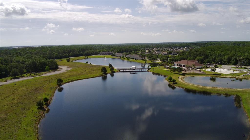 2543 Old Kent Circle Kissimmee, FL 34758 - Photo 26 of 41 a view of a lake with houses in back