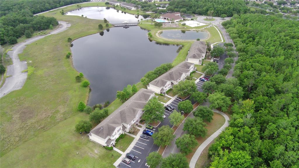 2543 Old Kent Circle Kissimmee, FL 34758 - Photo 3 of 41 an aerial view of a house with a yard and lake view