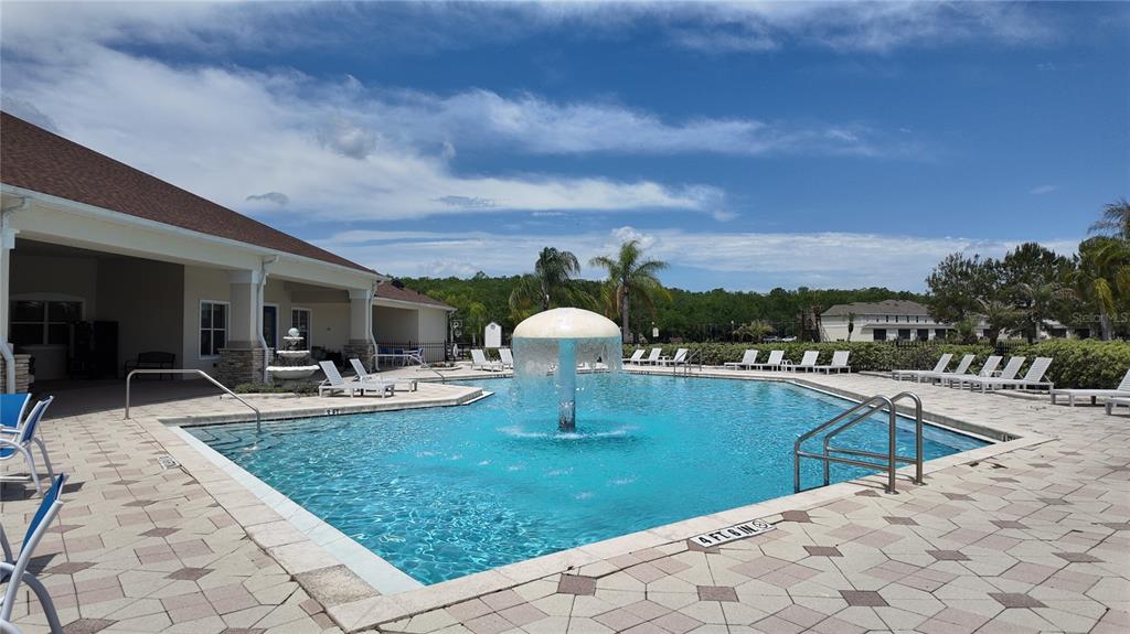 2543 Old Kent Circle Kissimmee, FL 34758 - Photo 31 of 41 a view of a swimming pool and lounge chair